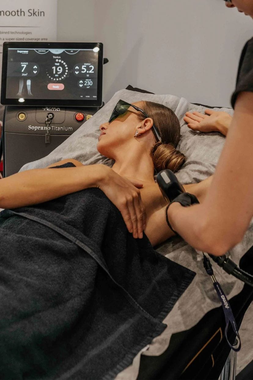 Female client undergoing underarm laser hair removal